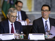Chủ tịch Fed - Jerome Powell (phải) và Bộ trưởng Tài chính Mỹ - Steven Mnuchin (trái). Ảnh: Bloomberg.