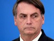 Tổng thống Brazil Bolsonaro công bố các biện pháp kinh tế trong đại dịch Covid-19 ở tại Brasilia hôm 27/3. Ảnh: Reuters.