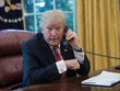 Tổng thống Trump tại văn phòng. Ảnh: AFP