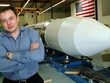 Elon Musk bên một tên lửa năm 2014. Ảnh: AFP