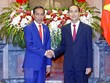 Chủ tịch nước Trần Đại Quang và Tổng thống Indonesia Joko Widodo tại lễ đón (Ảnh: Nhan Sáng/TTXVN)