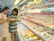 Người tiêu dùng mua thịt lợn tại siêu thị Hapro Mart Thanh Xuân, Hà Nội. (Ảnh: Đỗ Phương Anh/TTXVN).
