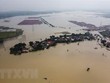 Cảnh ngập lụt sau những trận mưa lớn tại Bekasi, Tây Java, Indonesia. (Ảnh: AFP/TTXVN).