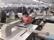 Hoạt động tại công ty TNHH xuất nhập khẩu may Hoa Công (thị xã An Nhơn, tỉnh Bình Định). (Ảnh: Nguyên Linh/TTXVN).