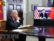 Tổng thống Mỹ Joe Biden (trái) và Chủ tịch Trung Quốc Tập Cận Bình trong cuộc họp trực tuyến ngày 15/11/2021. (Ảnh: AFP/TTXVN).