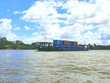 Một sà lan vận chuyển container trên sông Tiền.