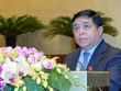 Bộ trưởng Bộ Kế hoạch và Đầu tư Nguyễn Chí Dũng, thừa ủy quyền của Thủ tướng Chính phủ trình bày Tờ trình dự án Luật hỗ trợ doanh nghiệp vừa và nhỏ