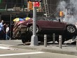 Chiếc xe bốc khói sau khi lao vào đám đông ở quảng trường Thời đại. Ảnh:Sky News