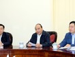 Thủ tướng Nguyễn Xuân Phúc, Phó Thủ tướng Phạm Bình Minh và Phó Thủ tướng Vương Đình Huệ tại cuộc họp. Ảnh: VGP/Quang Hiếu