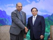 Thủ tướng Phạm Minh Chính và ông Karthik Rammohan, Phó Chủ tịch cấp cao Tập đoàn Lam Research (Hoa Kỳ). (Ảnh: Nhật Bắc)