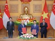 Thủ tướng Chính phủ Phạm Minh Chính; Thủ tướng Singapore Lawrence Wong chứng kiến lễ trao Biên bản ghi nhớ hợp tác giữa NAPAS và NETS nhằm triển khai thanh toán bán lẻ song phương qua mã QR giữa Việt Nam và Singapore