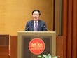 Phó Thủ tướng Chính phủ Hồ Quốc Dũng trình bày trước Quốc hội Báo cáo tiếp thu giải trình dự án Luật sửa đổi, bổ sung một số điều của 10 luật liên quan đến thủ tục hành chính, điều kiện kinh doanh trong lĩnh vực nông nghiệp và môi trường.