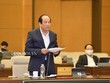 Bộ trưởng, Chủ nhiệm Văn phòng Chính phủ Mai Tiến Dũng trình bày báo cáo (Ảnh Quochoi.vn)