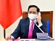 Thủ tướng Chính phủ Phạm Minh Chính điện đàm với Thủ tướng Nhật Bản Suga Yoshihide (Ảnh: Nhật Bắc)