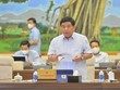 Bộ trưởng Bộ Kế hoạch và Đầu tư Nguyễn Chí Dũng báo cáo tại phiên họp. 