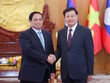 Thủ tướng Phạm Minh Chính hội kiến Tổng Bí thư, Chủ tịch nước Lào Thongloun Sisoulith. Ảnh: Nhật Bắc