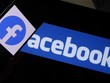 Biểu tượng của Facebook trên màn hình điện thoại thông minh. Ảnh: AFP/TTXVN