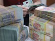 Việc nâng trần tỷ lệ vốn ngắn hạn cho vay trung dài hạn sẽ giảm bớt áp lực huy động vốn dài hạn cho các ngân hàng 