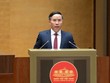 Thống đốc Ngân hàng Nhà nước Phạm Đức Ấn trình bày tờ trình - Ảnh: QH.