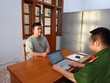 Vũ Hoàng Hải (còn gọi là Hải Sapa TV) tại Cơ quan điều tra. Ảnh: BCA