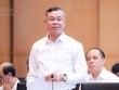 Bộ trưởng Bộ Tài chính Ngô Văn Tuấn hồi âm các vấn đề được đại biểu quan tâm - Ảnh: QH. 