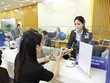 Các ngân hàng vẫn đang trong cuộc đua thu hút tiền gửi. Ảnh: Đức Thanh