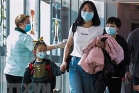 Hành khách tại sân bay quốc tế Changi, Singapore. Ảnh: TTXVN/AFP
