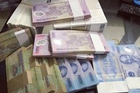 Kiểm soát chặt việc đổi tiền mới lì xì dịp tết Tân Sửu