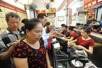 Sáng 7/7, vàng giảm xuống dưới 40 triệu đồng/lượng tỷ giá trung tâm tăng nhẹ