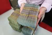 Cần ưu tiên kiểm soát mức độ mất giá VND để ổn định vĩ mô