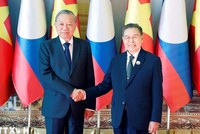 Tổng Bí thư Tô Lâm hội kiến Chủ tịch Quốc hội Lào Saysomphone Phomvihane. Ảnh: Thống Nhất/TTXVN.