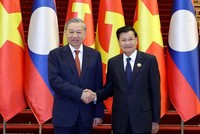 Tổng Bí thư Tô Lâm và Tổng Bí thư, Chủ tịch nước Lào Thongloun Sisoulith đồng chủ trì Cuộc gặp cấp cao giữa Đảng Cộng sản Việt Nam và Đảng Nhân dân Cách mạng Lào - Ảnh: Thống Nhất/TTXVN.