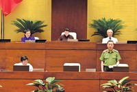 Bộ trưởng Bộ Công an Tô Lâm trả lời chất vấn của các đại biểu Quốc hội hôm qua (4/6).