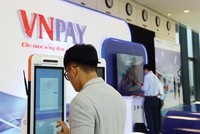 Covid-19 khiến nhu cầu thanh toán điện tử tăng vọt. Ảnh: Đức Thanh