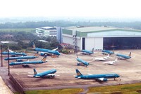 Máy bay của Vietnam Airlines đỗ tại nhà ga của sân bay quốc tế Nội Bài. Ảnh: Đức Thanh