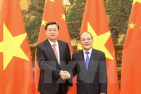 Chủ tịch Quốc hội Nguyễn Sinh Hùng và Chủ tịch Nhân Đại Trương Đức Giang tại lễ đón
