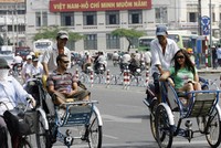 Khách du lịch quốc tế tại TP HCM (Ảnh: Hoang Dinh Nam/AFP)