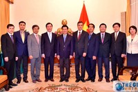 Phó Thủ tướng, Bộ trưởng Ngoại giao Phạm Bình Minh cùng các đại biểu dự lễ trao quyết định. Ảnh TGVN