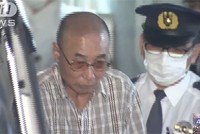 "Thánh móc túi" Kazutoshi Yamaguchi bị cảnh sát áp giải ở Tokyo hôm 21/5. Ảnh: ANN News