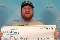 Anh Tyler đã đóng khung tấm séc treo trong nhà. Ảnh:NBC.