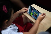 Trẻ em cũng có thể bị xem những video có nội dung xấu trên mạng xã hội như Youtube. Ảnh: Straight Times.