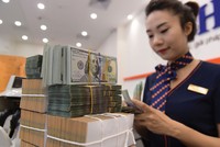 Việc NHNN đẩy mạnh mua vào ngoại tệ và tăng cung tiền ra thị trường giúp thanh khoản dồi dào.