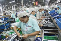 Dịch bệnh tiếp tục ảnh hưởng tới sản xuất - kinh doanh của các doanh nghiệp FDI. Trong ảnh: Nhà máy của Canon tại Khu công nghiệp Bắc Thăng Long (Hà Nội).