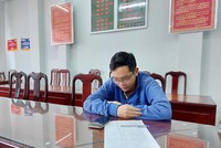 H. tại cơ quan công an. (Nguồn: TTXVN phát).