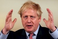 Johnson họp báo về Covid-19 tại Văn phòng Thủ tướng Anh hôm 12/3. Ảnh: Reuters.