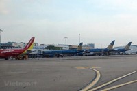 Máy bay của các hãng hàng không Vietnam Airlines và Vietjet. (Ảnh: Việt Hùng/Vietnam+).