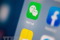 Biểu tượng WeChat trên một màn hình điện thoại. (Ảnh: AFP/TTXVN).