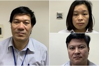 Bị can Nguyễn Nhật Cảm (trái) cùng đồng phạm vụ nâng khống máy xét nghiệm Covid-19.