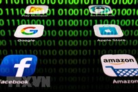 Biểu tượng của Amazon, Apple, Google và Facebook. (Ảnh: AFP/TTXVN).