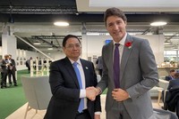 Thủ tướng Chính phủ Phạm Minh Chính và Thủ tướng Canada Justin Trudeau - Ảnh: TTXVN.